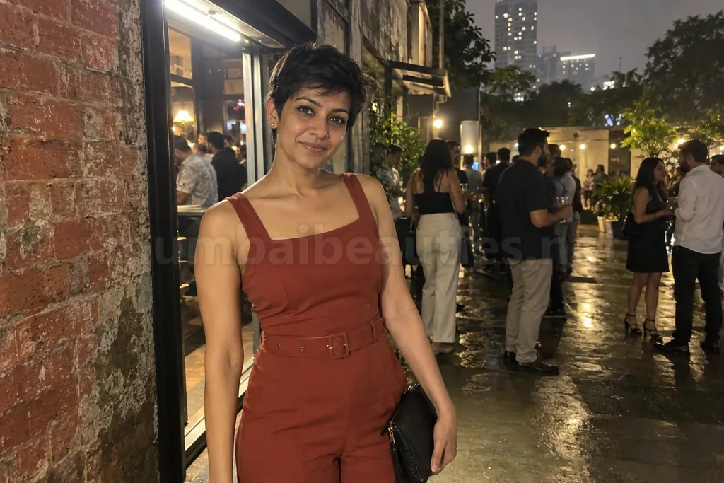Woman outside a pub in the Kamala Mills compound at night, string lights behind her – Lower Parel escorts