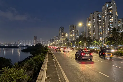 Palm Beach Road at night along the mangroves, lit towers of Nerul and Sanpada, Navi Mumbai escorts