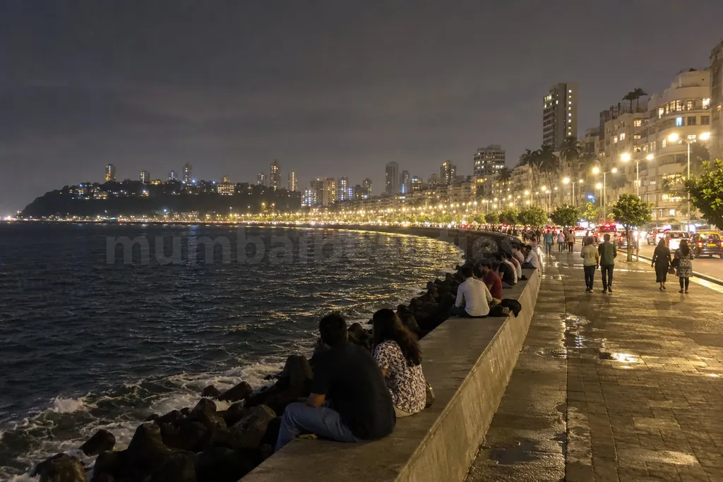 Marine Drive at night, the long curve of street lights along the dark sea – South Mumbai escorts